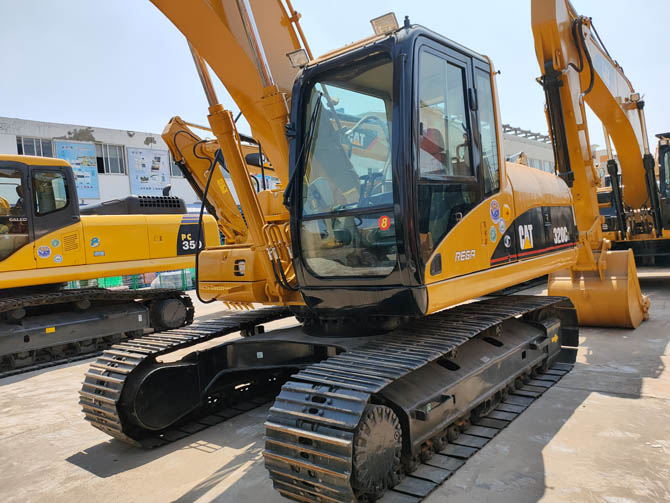 Cat 320 excavator with breaker attachment