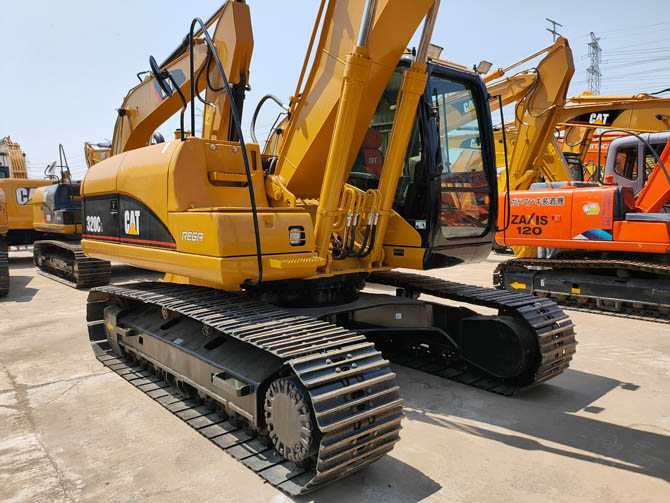 Cat 320 excavator with breaker attachment