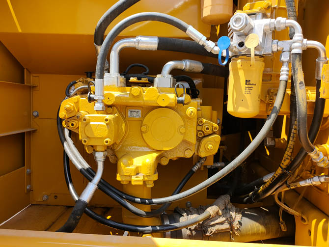 Cat 320 excavator with breaker attachment