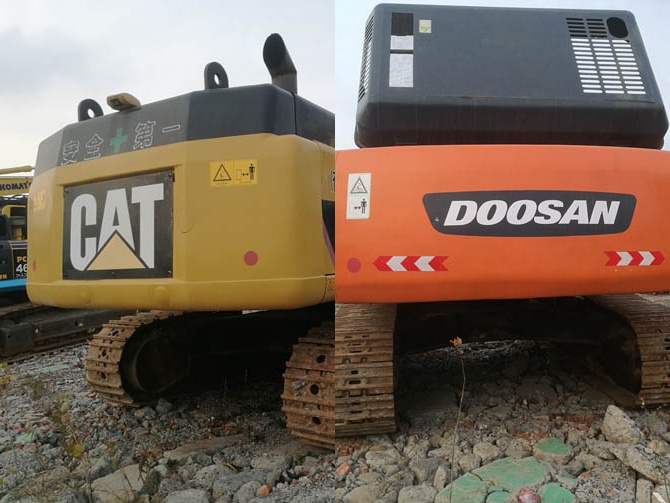 Caterpillar and Doosan excavators side by side