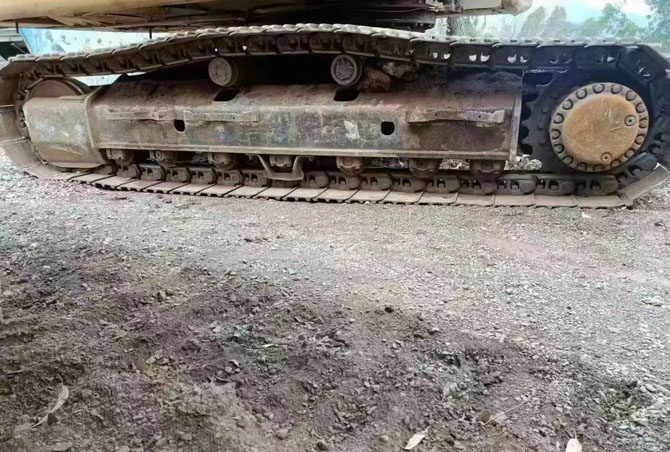 Cat 330 excavator with hydraulic breaker working on construction site