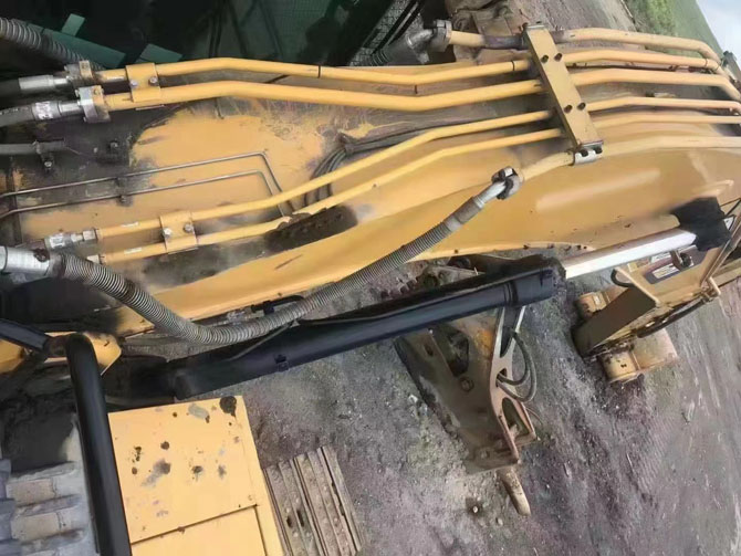 Cat 330 excavator with hydraulic breaker working on construction site