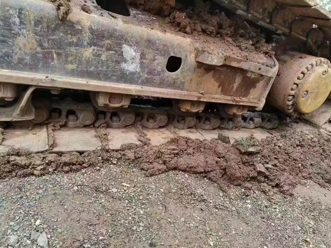 Cat 330 excavator with hydraulic breaker working on construction site