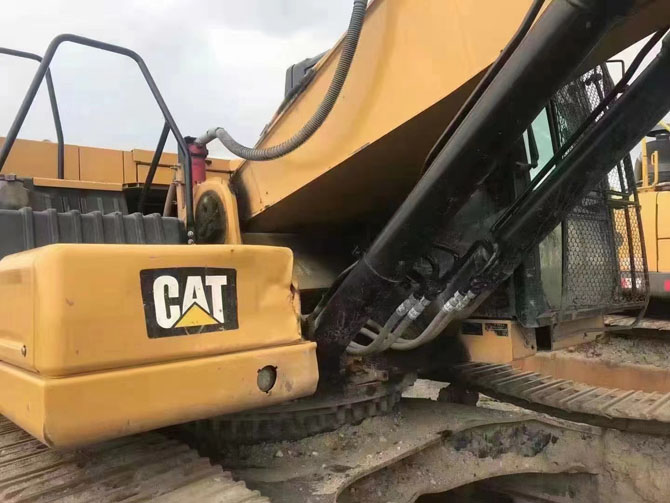 Cat 330 excavator with hydraulic breaker working on construction site