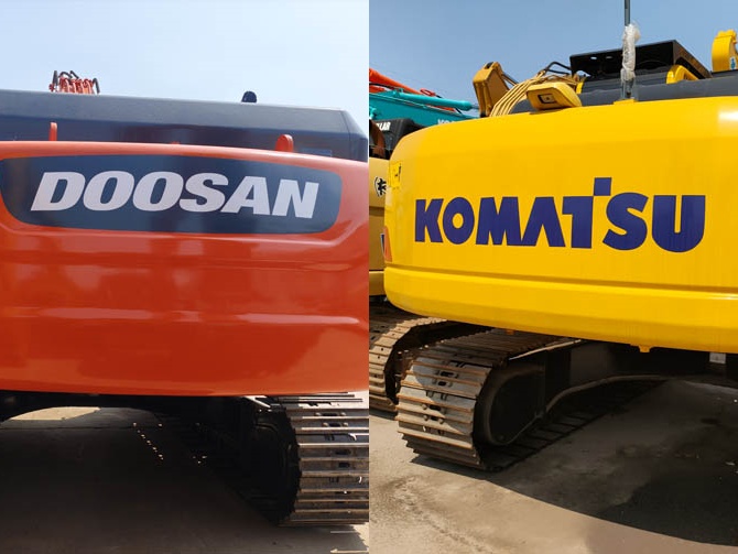 Doosan and Komatsu excavators working on a site comparison