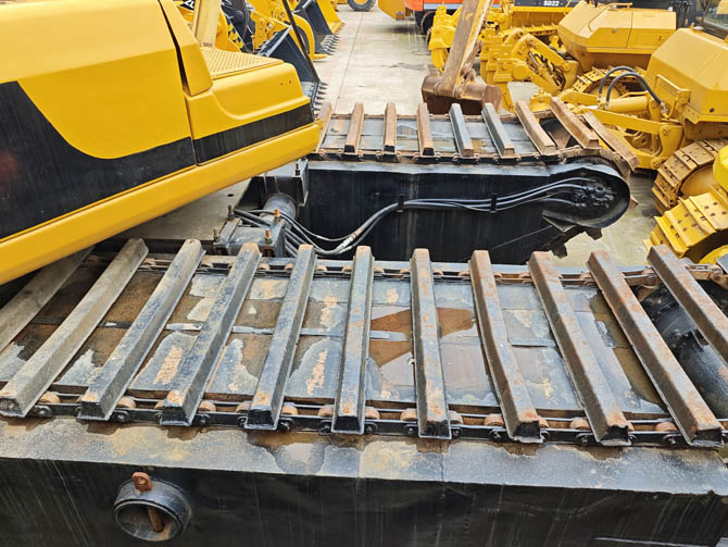 Swamp buggy Cat 320BL excavator in wetland working condition