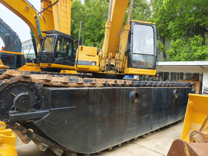 Swamp buggy Cat 320BL excavator in wetland working condition
